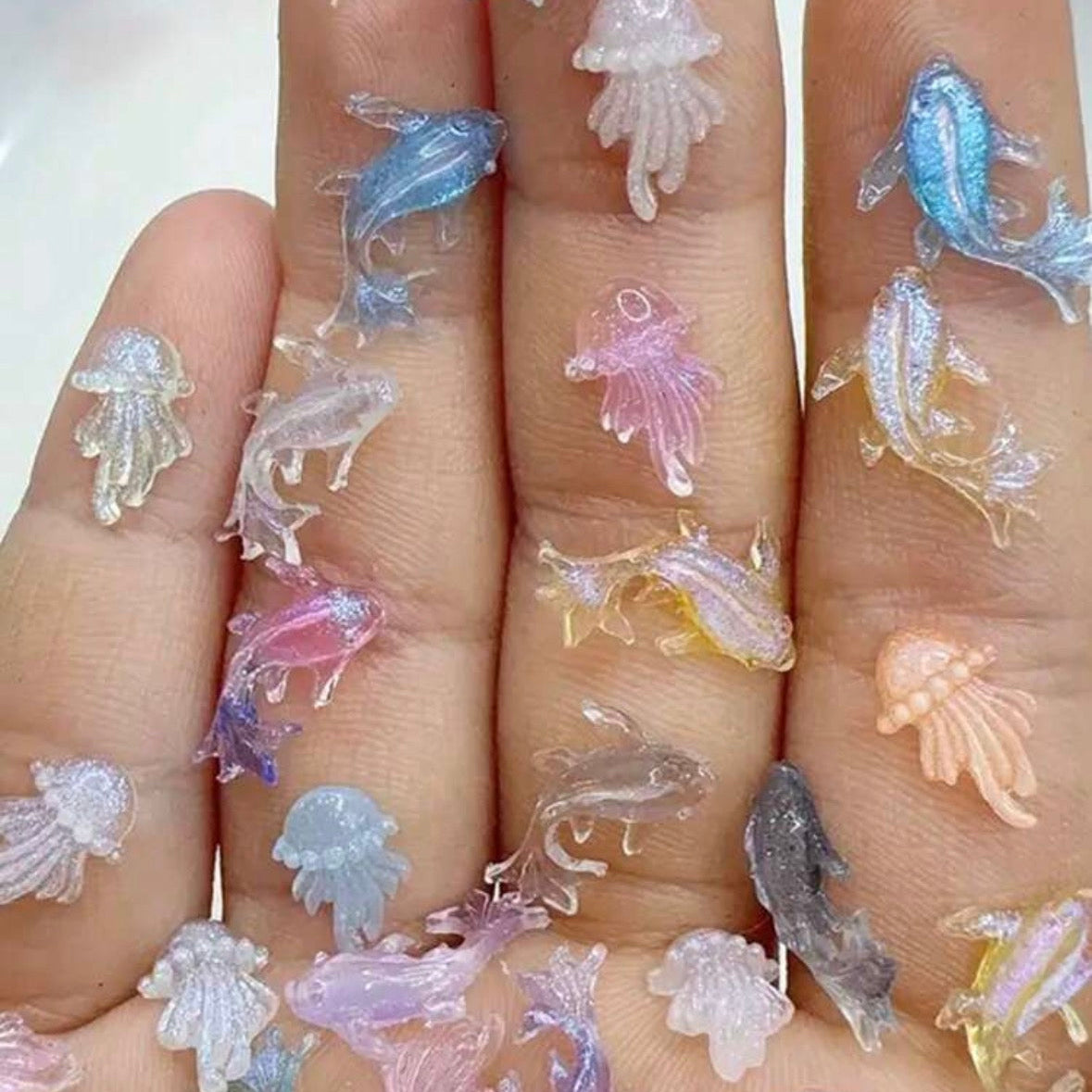 colorful jellyfish charms on a neutral background