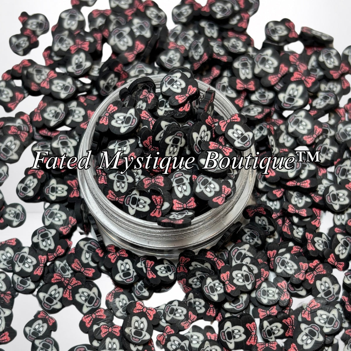 Minnie polymer clay slices displayed in a clear jar with loose slices on a white background