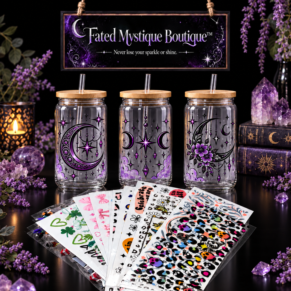 Fanned UV DTF transfer sheets and three purple celestial glass cups on a black background beneath the Fated Mystique Boutique banner.