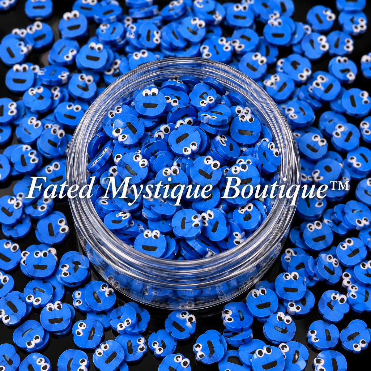Cookie Monster polymer clay slices in a clear jar with loose slices on a black background