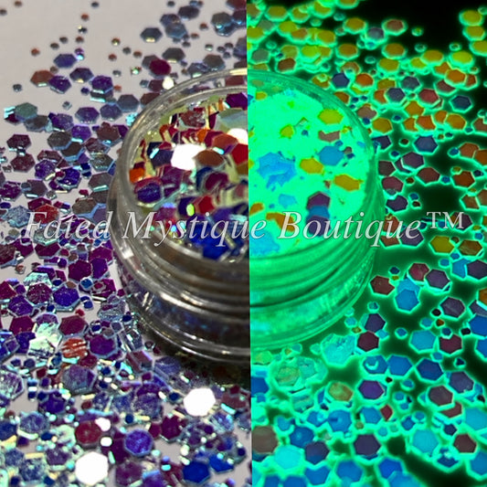 Cosmic Rainbow chunky color-shifting glitter shown in normal and glow lighting — Fated Mystique Boutique