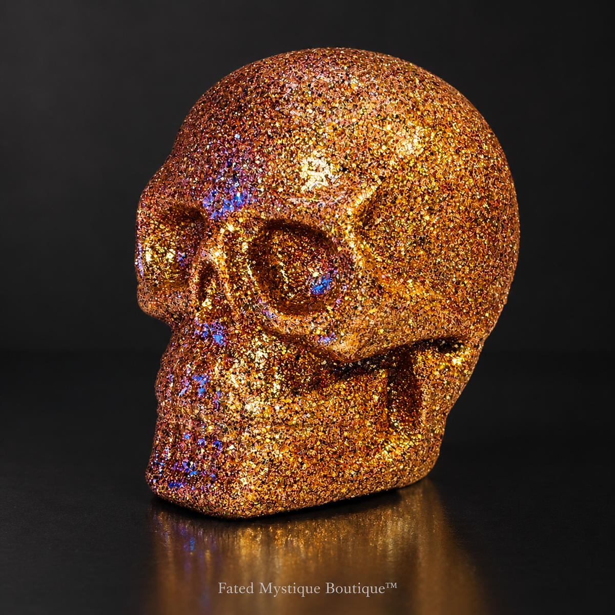Orange glitter skull on a charcoal studio background