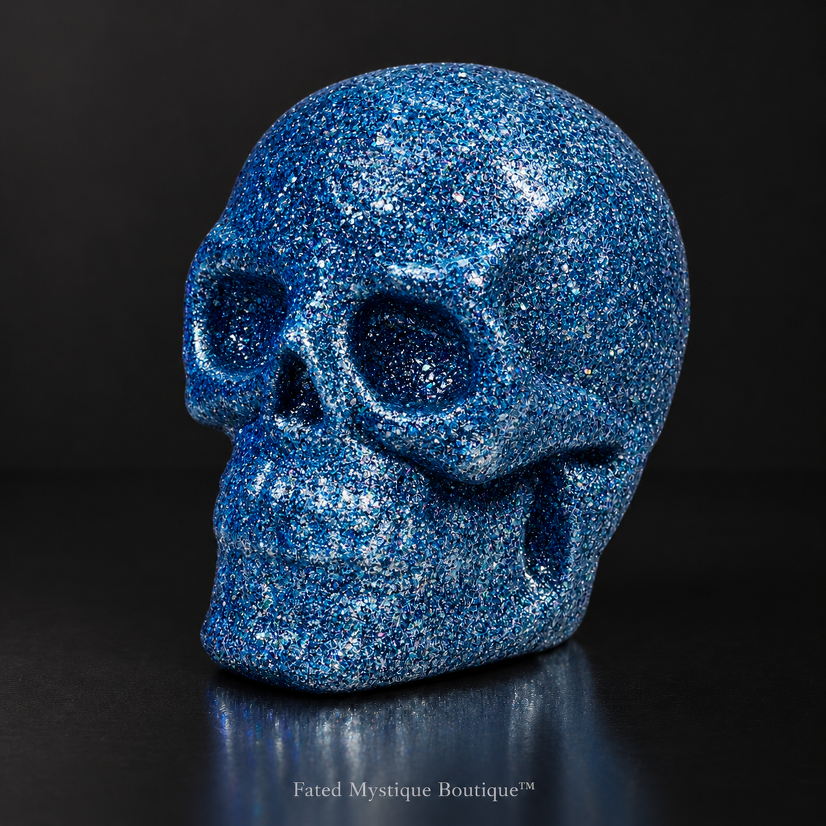 Blue glow in the dark glitter skull head for gothic Halloween tabletop decor — charcoal studio mockup
