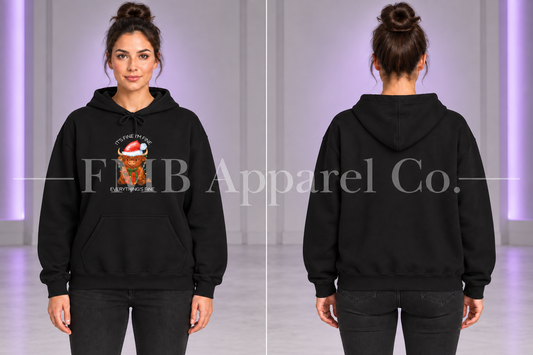 Black Everything’s Fine Christmas Cow hoodie, front graphic and plain back on a model.