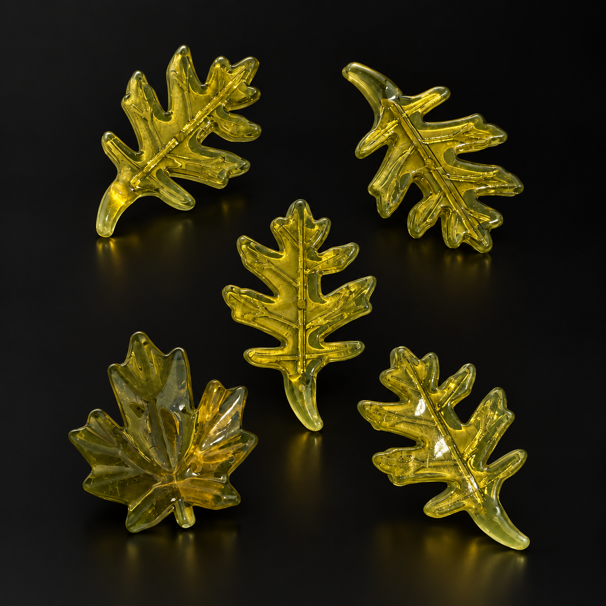 Large Green Leaf Charms – 5 Pieces on a black studio background