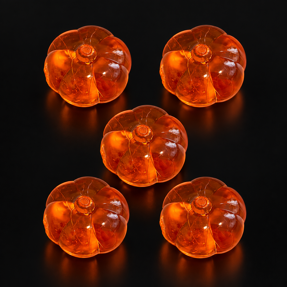 Large Pumpkin Charms – 5 Pieces on a black studio background