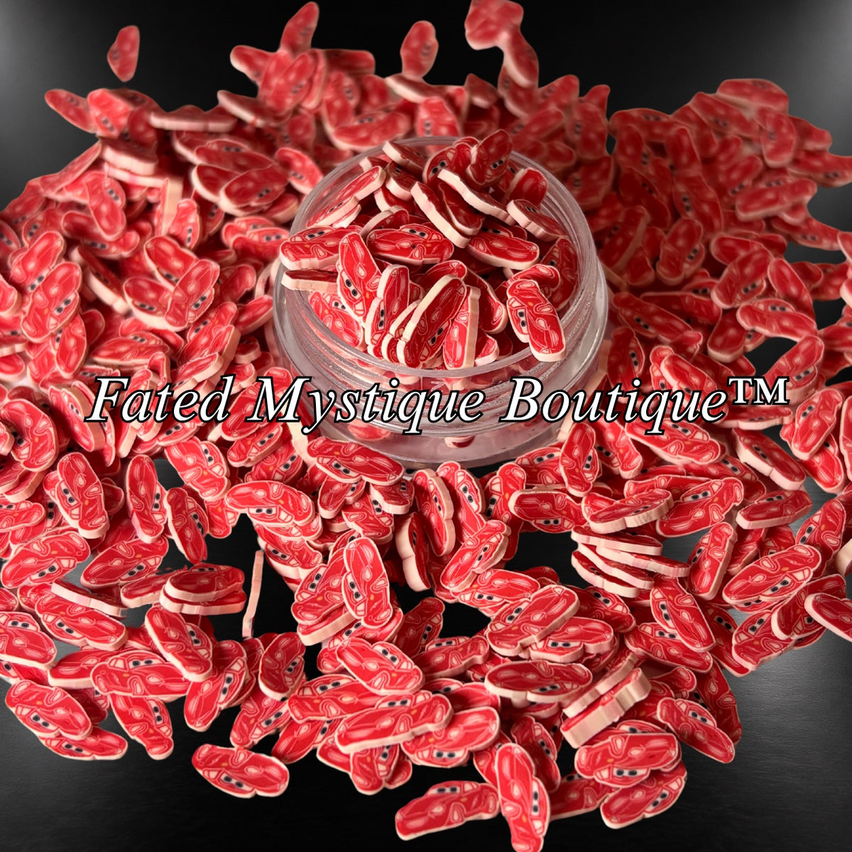 Lightning McQueen red race car polymer clay slices in a clear jar with scattered slices on a black background