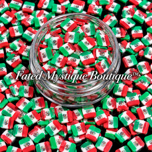 Mexican Flag polymer clay slices in a clear jar with loose slices on a black background