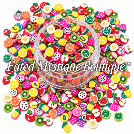 Multicolored mixed fruit polymer clay slices displayed in a clear jar with scattered slices on white.