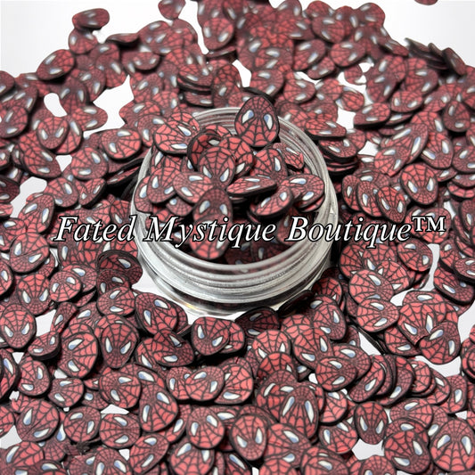 Spider-Man red mask polymer clay slices displayed in a clear jar with scattered slices