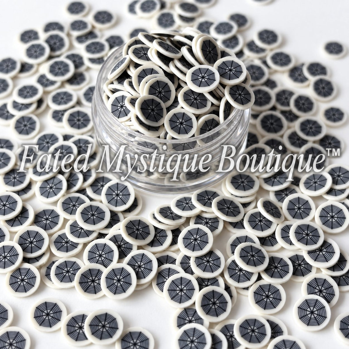 Spiderweb-themed polymer clay slices for Halloween snow globe tumblers and DIY craft projects