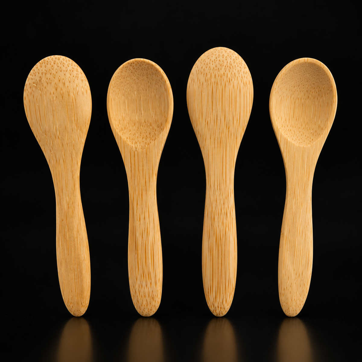 Wooden Spoon Charms – 4 Pieces on a black studio background