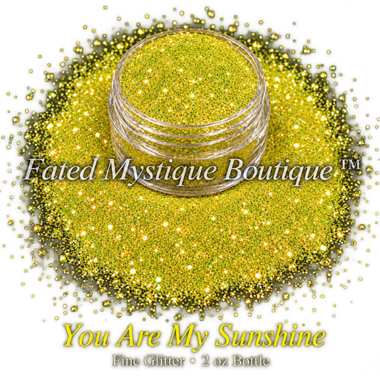 You Are My Sunshine sunny yellow fine glitter with gold and green reflective flashes in a clear jar on black; 2 oz bottle.